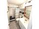 Bathroom with updated shower, tile floor, contemporary mirror and vanity at 220 La Casa # 220, Lake Wales, FL 33898