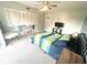 Cozy bedroom featuring a ceiling fan, spacious closet, and comfortable bed at 220 La Casa # 220, Lake Wales, FL 33898
