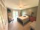 Comfortable bedroom featuring natural light, a ceiling fan, and neutral carpet at 220 La Casa # 220, Lake Wales, FL 33898
