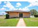 Exterior of clubhouse showing well-maintained landscaping and easy access to amenities at 220 La Casa # 220, Lake Wales, FL 33898