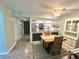 Bright dining room next to the kitchen with modern lighting and decor at 220 La Casa # 220, Lake Wales, FL 33898