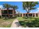 Exterior view of the community featuring screened patios and well-maintained landscaping at 220 La Casa # 220, Lake Wales, FL 33898