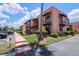 Exterior of condo building with lush landscaping and private balconies at 220 La Casa # 220, Lake Wales, FL 33898