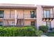 Charming condo building with well-maintained landscaping and inviting entrance ways at 220 La Casa # 220, Lake Wales, FL 33898