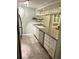 Bright kitchen featuring tile floors, sleek countertops, and stainless steel appliances at 220 La Casa # 220, Lake Wales, FL 33898