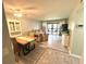 Open-concept living area featuring stylish decor and a sliding door to the lanai at 220 La Casa # 220, Lake Wales, FL 33898