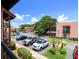 Scenic view of the community parking lot under a clear blue sky showcasing well-maintained landscaping at 220 La Casa # 220, Lake Wales, FL 33898