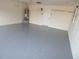 Garage with epoxy coated flooring at 231 Lake Suzanne Dr, Lake Wales, FL 33859