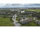 Aerial perspective of residences surrounded by trees, bodies of water and lush greenery at 3017 Mission Lakes Dr, Lakeland, FL 33803
