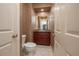 Compact bathroom with a toilet, tile flooring, and a vanity with storage at 3017 Mission Lakes Dr, Lakeland, FL 33803