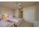 Bedroom with carpet, twin beds, and ceiling fan at 3017 Mission Lakes Dr, Lakeland, FL 33803