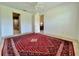 Bright, carpeted bedroom offers ample space and includes doorway access to an en-suite bathroom at 3017 Mission Lakes Dr, Lakeland, FL 33803