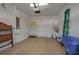 Clean garage area with a hot water tank and open storage space at 3017 Mission Lakes Dr, Lakeland, FL 33803