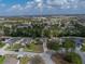 Aerial view of the home showing its location within a wooded suburban neighborhood at 1029 Evans Loop, Lake Wales, FL 33853