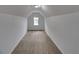 An attic space with carpeted floors and one window at 1029 Evans Loop, Lake Wales, FL 33853