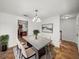 Bright dining room featuring modern chandelier, decor, and ceramic tile floors at 1029 Evans Loop, Lake Wales, FL 33853