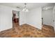 Bright dining room with tile floors, a classic chandelier, and views into the kitchen at 1029 Evans Loop, Lake Wales, FL 33853