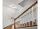 View of front door and staircase in foyer with hardwood steps at 1029 Evans Loop, Lake Wales, FL 33853