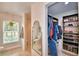 Modern bathroom featuring an enclosed shower, walk-in closet, and window for natural light and ventilation at 112 Reedy Creek Dr, Frostproof, FL 33843