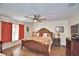 Spacious bedroom with king-size bed and ceiling fan at 112 Reedy Creek Dr, Frostproof, FL 33843