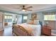 Spacious bedroom with ceiling fan and en-suite bathroom access at 112 Reedy Creek Dr, Frostproof, FL 33843