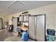 Garage featuring metal storage, water heater, work area, and durable flooring at 112 Reedy Creek Dr, Frostproof, FL 33843