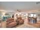 Inviting living room with hardwood floors that seamlessly flows into the kitchen and dining area at 112 Reedy Creek Dr, Frostproof, FL 33843