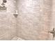 Luxurious shower featuring stylish tile and modern fixtures at 112 Reedy Creek Dr, Frostproof, FL 33843