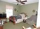 Cozy bedroom with a bed and armchair at 1163 Cephia St, Lake Wales, FL 33853