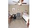 Bedroom with a bed, chair, and workspace at 1163 Cephia St, Lake Wales, FL 33853