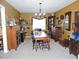 Formal dining room showcasing a rustic wooden table and period-appropriate furnishings at 1163 Cephia St, Lake Wales, FL 33853