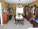 Formal dining room showcasing a rustic wooden table and period-appropriate furnishings at 1163 Cephia St, Lake Wales, FL 33853