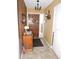 Bright entryway with wood-paneled walls and tiled flooring at 1163 Cephia St, Lake Wales, FL 33853