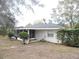 Back exterior view of house with screened porch at 1163 Cephia St, Lake Wales, FL 33853