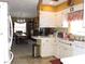 Eat-in kitchen with views into dining area and access to the backyard at 1163 Cephia St, Lake Wales, FL 33853