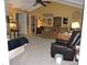 Living room with vaulted ceilings, hardwood floors, and ample natural light at 1163 Cephia St, Lake Wales, FL 33853