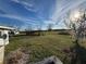 Large backyard with grassy area and trees at 2000 Mcclellan Rd, Frostproof, FL 33843