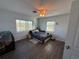 Bright bedroom with wood-look floors and a ceiling fan at 2000 Mcclellan Rd, Frostproof, FL 33843