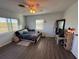 Spacious bedroom featuring wood floors and ample natural light at 2000 Mcclellan Rd, Frostproof, FL 33843