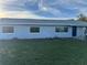 Ranch home with blue door and new windows at 2000 Mcclellan Rd, Frostproof, FL 33843