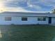 Ranch home with blue door and new windows at 2000 Mcclellan Rd, Frostproof, FL 33843