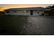 Newly painted light gray house with a blue door, and a grassy yard at 2000 Mcclellan Rd, Frostproof, FL 33843