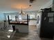 Kitchen with island, stainless steel appliances, and white cabinets at 2000 Mcclellan Rd, Frostproof, FL 33843