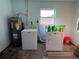 Laundry room with washer, dryer and water heater at 2000 Mcclellan Rd, Frostproof, FL 33843