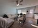 Living room featuring wood-look floors and a ceiling fan at 2000 Mcclellan Rd, Frostproof, FL 33843