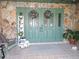 Front porch features double doors and festive holiday decor at 2153 Capps Rd, Lake Wales, FL 33898