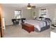 Spacious main bedroom featuring a king-size bed and ceiling fan at 2153 Capps Rd, Lake Wales, FL 33898