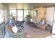 Bright and airy screened porch furnished with comfortable seating and fans at 2153 Capps Rd, Lake Wales, FL 33898