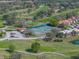 Aerial view features tennis courts, putting green, mature trees and lush landscaping in a beautiful community at 2680 Clubhouse Dr, Lake Wales, FL 33898