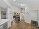 Bright dining area with skylights, a sliding barn door, and a view to a garden at 2680 Clubhouse Dr, Lake Wales, FL 33898